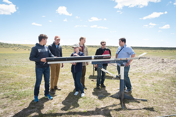 The Rocket Team from the Mechanical Engineering Department gather together to prepare for their rocket launch.