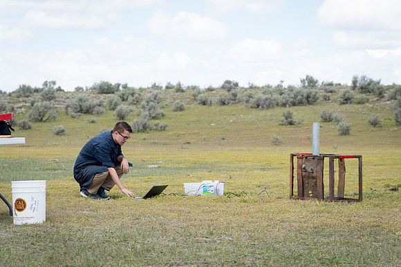 The Rocket Team from the Mechanical Engineering Department gather together to prepare for their rocket launch.