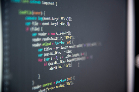 Employees work on developing a better curriculum for online students.