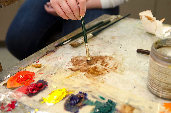 David Belka enthusiatically teaches painting principles to beginning painting class.