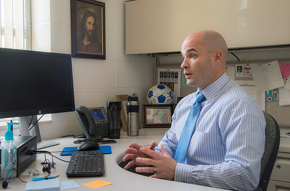 Joseph Anderson working with a student in an Anatomy and Physiology Lab.
