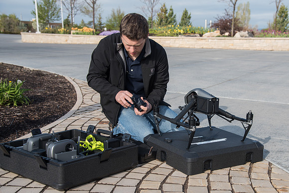 Patrick Kelly gets the drone ready to fly.