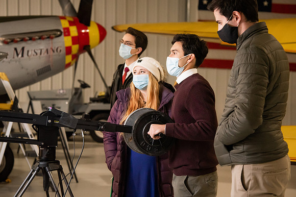 BYUI President and Sister Eyring film their devotional promotional video for Spring 2021 semester with the help of the University Relations team in the Legacy Flight Museum.