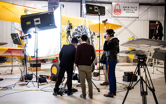 BYUI President and Sister Eyring film their devotional promotional video for Spring 2021 semester with the help of the University Relations team in the Legacy Flight Museum.