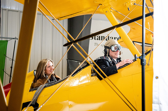 BYUI President and Sister Eyring film their devotional promotional video for Spring 2021 semester with the help of the University Relations team in the Legacy Flight Museum.