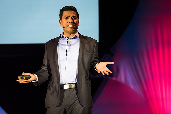 Carlos Carrasco, a product marketing manager for Microsoft, speaks at Power to Become. Spring 2017