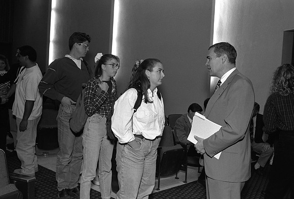 1993, Pres. Bennion talking with students after an Academic Lecture.