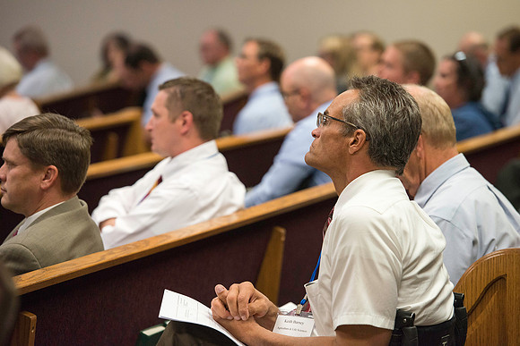 Faculty gather in the Hinckley Building for a conference to learn from their peers.