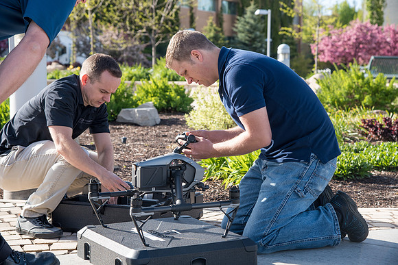 Patrick Kelly preps the drone for aerials of BYU-Idaho campus.