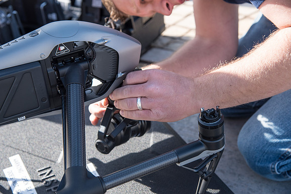 Patrick Kelly preps the drone for aerials of BYU-Idaho campus.
