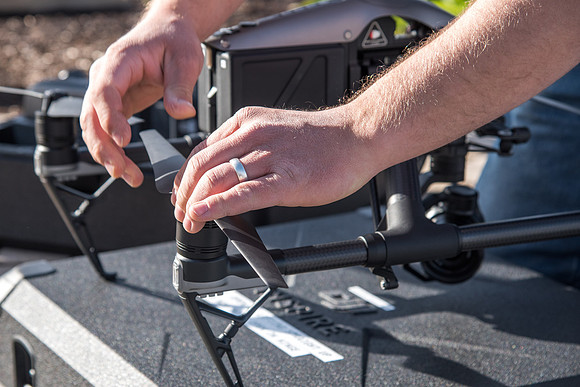 Patrick Kelly preps the drone for aerials of BYU-Idaho campus.