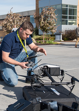Patrick Kelly preps the drone for aerials of BYU-Idaho campus.