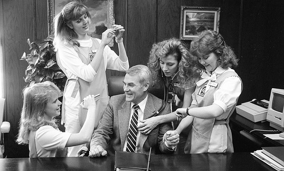 President Christensen doing a photoshoot with Nursing Students