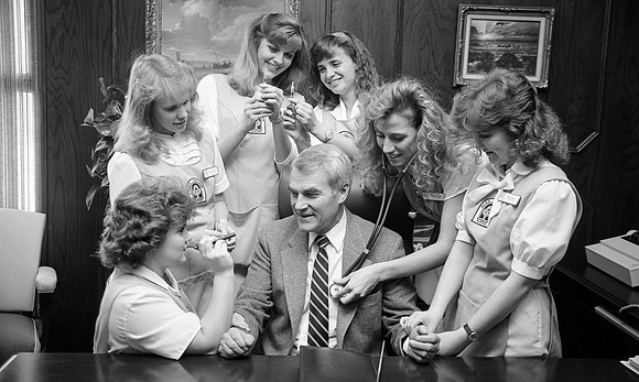 President Christensen doing a photoshoot with Nursing Students
