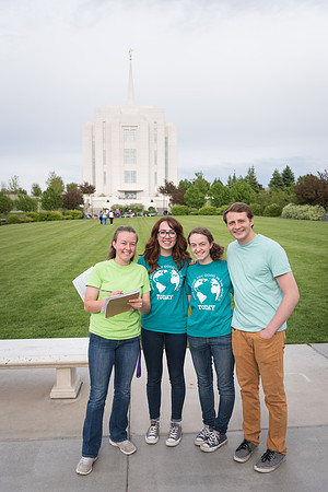 Students gather together to plant flowers on the temple grounds.