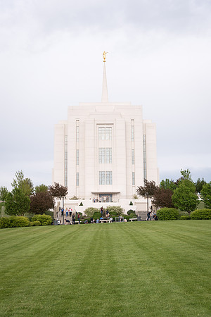 Students gather together to plant flowers on the temple grounds.