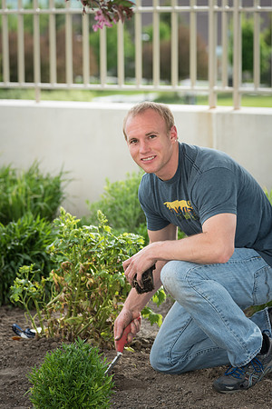Students gather together to plant flowers on the temple grounds.