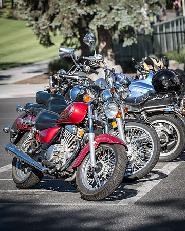 A row of motorcycles are parked on the BYU-Idaho campus. 2017