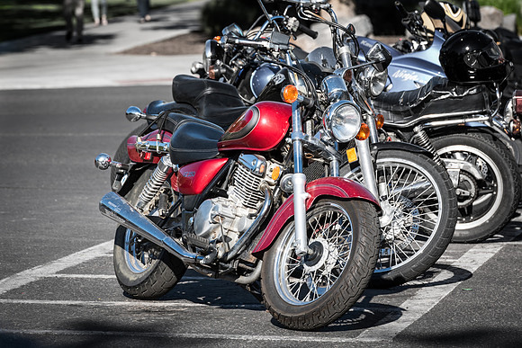 A row of motorcycles are parked on the BYU-Idaho campus. 2017