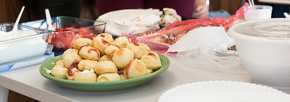 Students prepare and present food from around the world for their class.
