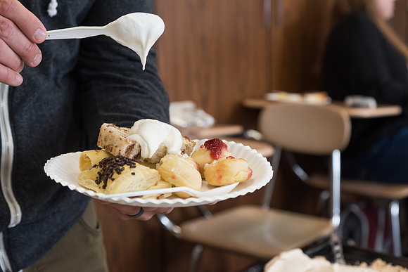 Students prepare and present food from around the world for their class.