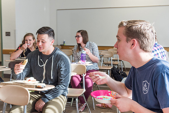 Students prepare and present food from around the world for their class.