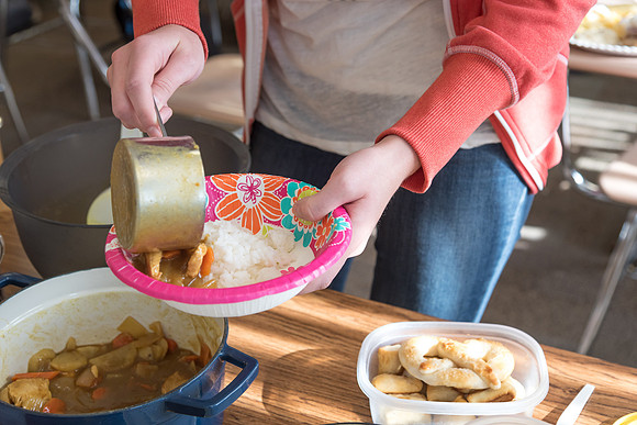 Students prepare and present food from around the world for their class.