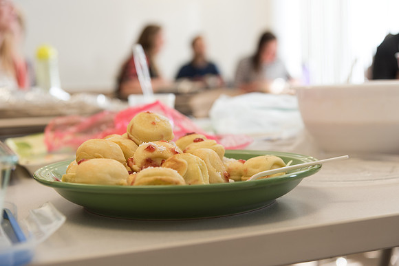 Students prepare and present food from around the world for their class.
