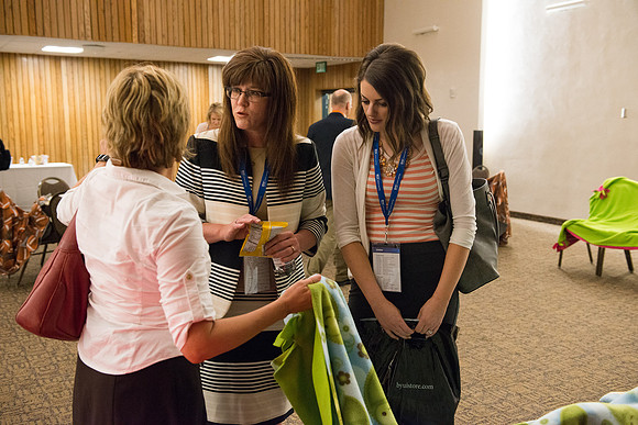 Online Instructors gather to learn at the Online Learning & Teaching Conference at BYU-Idaho. Participants have the opportunity do a little service, quilting. 2017