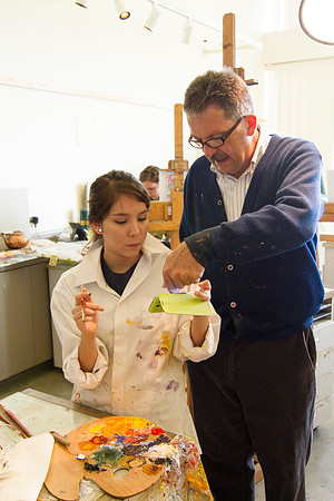 Brother Vince Bodily talks with a student about the landscape that she is painting.