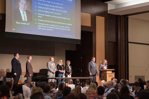 Online Employees gather together for a Banquet and Awards Ceremony for their final evening together.