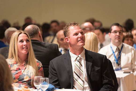Online Employees gather together for a Banquet and Awards Ceremony for their final evening together.