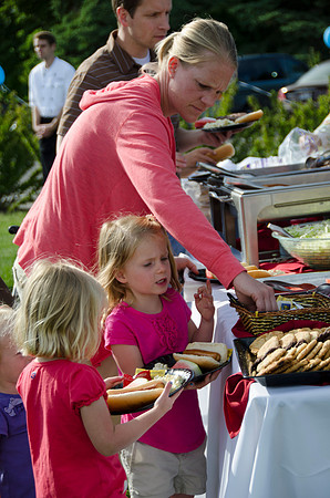 Online instructors gather with their families for an eveing of BBQ and games.