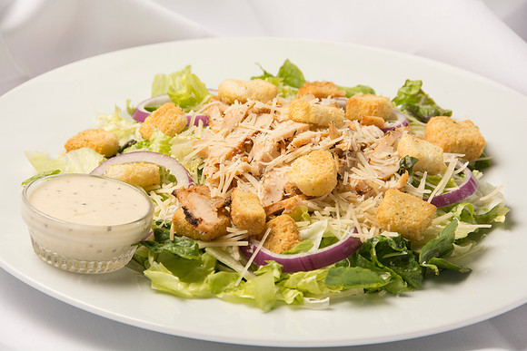 Romaine Lettuce with thinly sliced Red Onion, Fresh Parmesan Cheese, Grilled Chicken, and Croutons. Comes with Caesar Dressing.