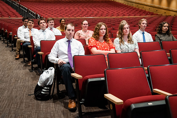 Ushers perform their duties in the I-Center to prepare for devotional. Used for an usher training video.