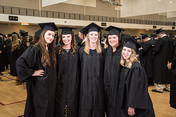 Students Kelsey Evans, Jessica Guerrero, Kiley Blaylock, Michelle Talbot, and Joye Robinson (pictured left to right) graduate with a Bachelor's of Art in Photography. Photo by Courtney Thomas.