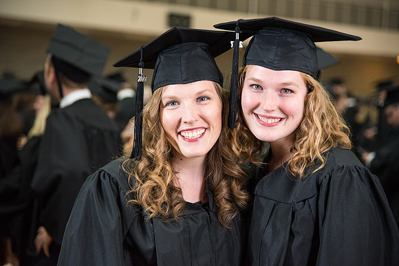 Students gather in the BYU-Idaho Center with fellow classmates before Processional.