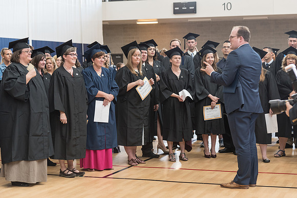 Pathway students gather together before their graduation.