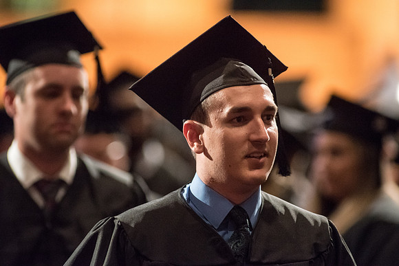Kyle Braby graduates in the College of Business and Communication. Photo by Garrett Blanchard.