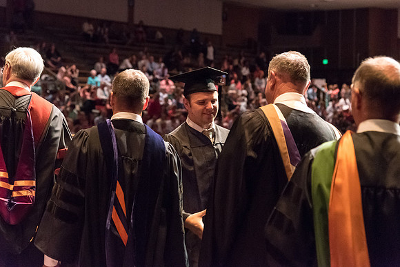 Business and Communications students walk across the stage and receive their diplomas. 2017