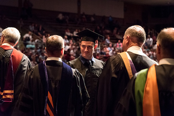 Business and Communications students walk across the stage and receive their diplomas. 2017