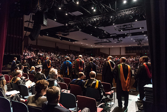 Business and Communications students walk across the stage and receive their diplomas. 2017