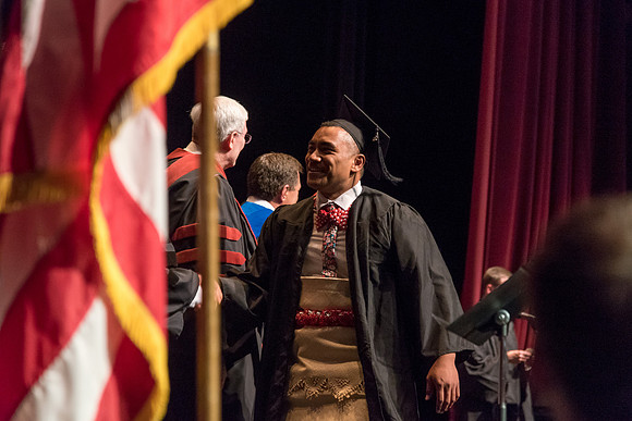 Business and Communications students walk across the stage and receive their diplomas. 2017