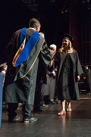 Business and Communications students walk across the stage and receive their diplomas. 2017