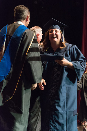 Business and Communications students walk across the stage and receive their diplomas. 2017
