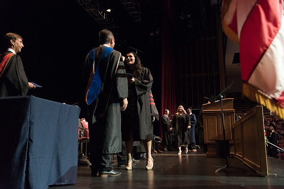 Business and Communications students walk across the stage and receive their diplomas. 2017