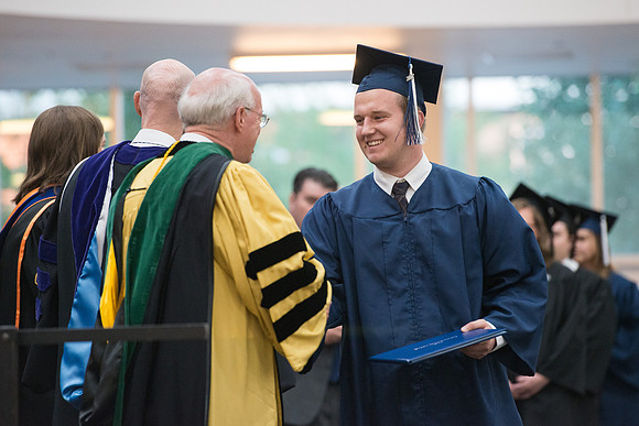 Elder Cornish and President Eyring congratulate graduates. Convocation for Foundations and Interdisciplinary Studies graduates. July 2017