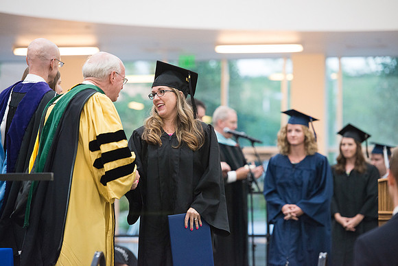Elder Cornish and President Eyring congratulate graduates. Convocation for Foundations and Interdisciplinary Studies graduates. July 2017