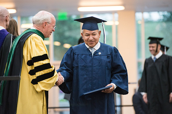 Elder Cornish and President Eyring congratulate graduates. Convocation for Foundations and Interdisciplinary Studies graduates. July 2017