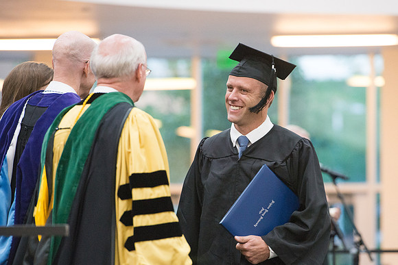 Elder Cornish and President Eyring congratulate graduates. Convocation for Foundations and Interdisciplinary Studies graduates. July 2017